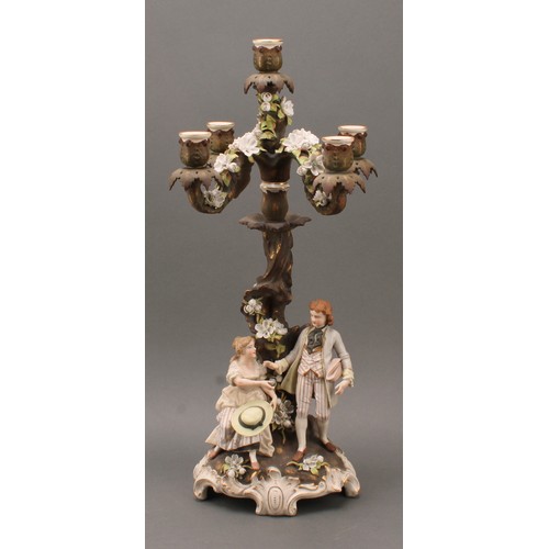 259 - A pair of Sitzendorf porcelain figural five-light candelabra, modelled as courting couples, each pai... 