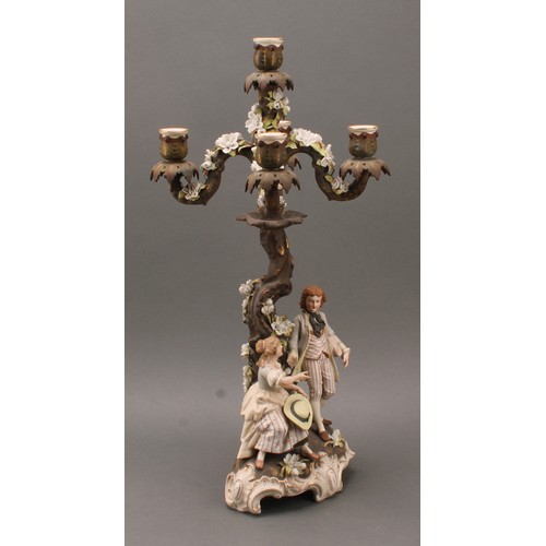 259 - A pair of Sitzendorf porcelain figural five-light candelabra, modelled as courting couples, each pai... 