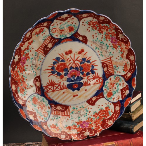 1304 - A Japanese shaped circular charger, decorated in the Imari palette, 40.5cm diameter, Meiji period