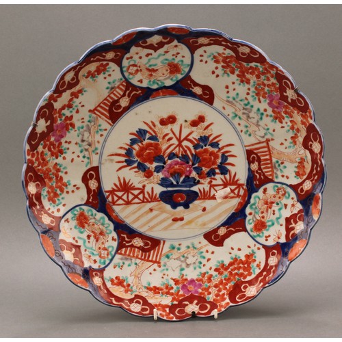 1304 - A Japanese shaped circular charger, decorated in the Imari palette, 40.5cm diameter, Meiji period