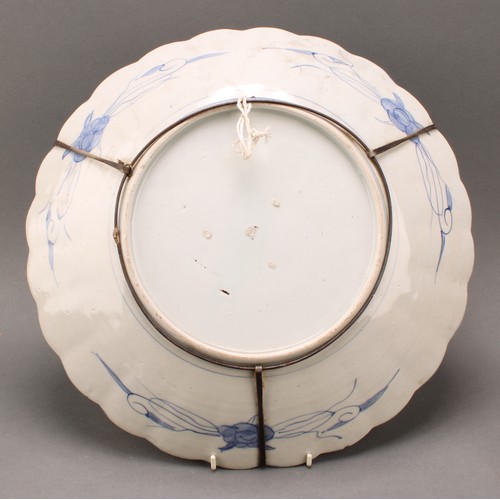 1304 - A Japanese shaped circular charger, decorated in the Imari palette, 40.5cm diameter, Meiji period