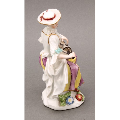 280 - An 18th century porcelain figure, Harlequin, he sits with bagpipes, blue crossed sword mark, 13.5cm ... 