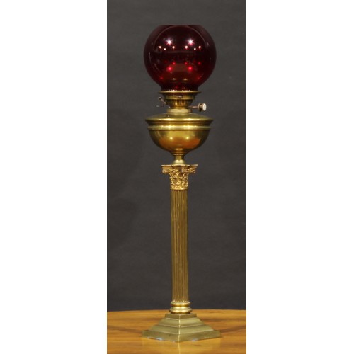 2484 - An early 20th century brass Corinthian column table oil lamp, Hinks & Son patent burner, ruby glass ... 