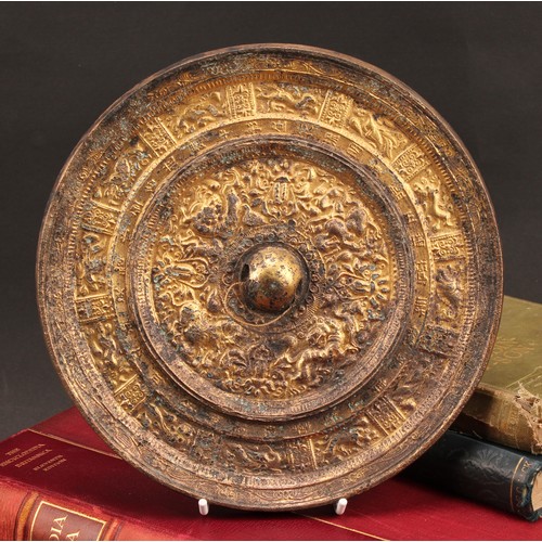 1283 - A Chinese gilt bronze circular mirror, cast with a border of zodiac animals, 21.5cm diameter