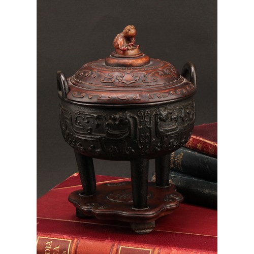 1277 - A Chinese bronze tripod censer, in the Archaic taste, hardwood cover with agate finial carved as a g... 