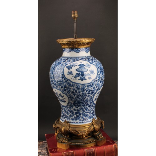 1305 - A large Chinese baluster vase, painted in tones of underglaze blue precious objects, within lotus sh... 