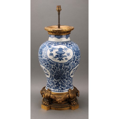 1305 - A large Chinese baluster vase, painted in tones of underglaze blue precious objects, within lotus sh... 