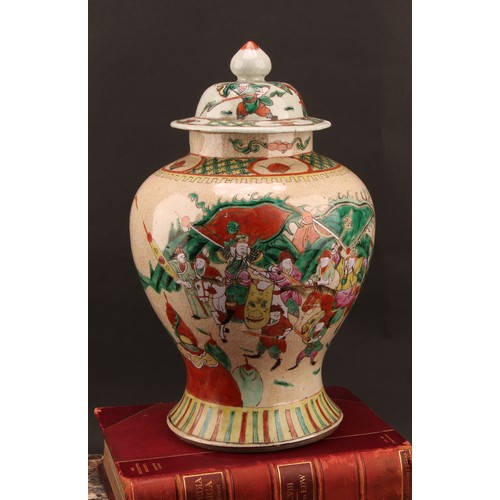 1294 - A Chinese baluster jar and cover, painted in polychrome enamels with warriors, on a crackle glaze gr... 