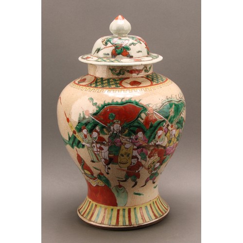 1294 - A Chinese baluster jar and cover, painted in polychrome enamels with warriors, on a crackle glaze gr... 