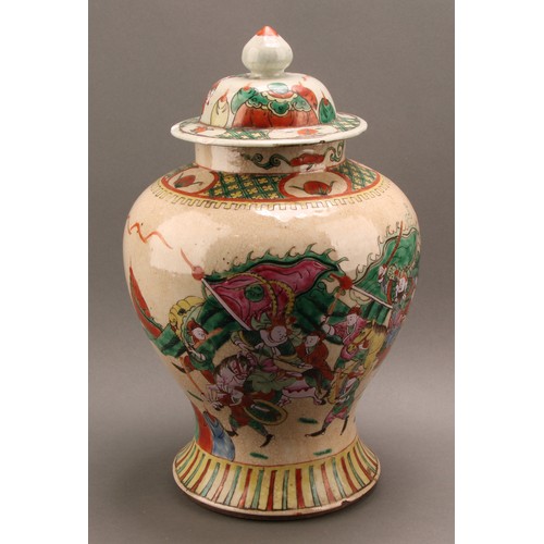 1294 - A Chinese baluster jar and cover, painted in polychrome enamels with warriors, on a crackle glaze gr... 