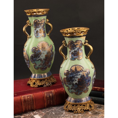 1363 - A pair of Chinese lobed oval vases, moulded and painted in tones of underglaze blue with panels of p... 