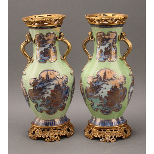 1363 - A pair of Chinese lobed oval vases, moulded and painted in tones of underglaze blue with panels of p... 