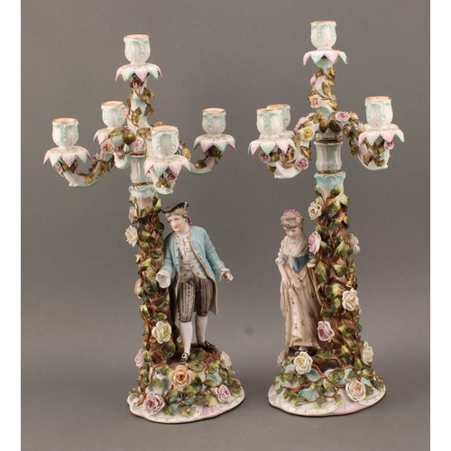 258 - A pair of Sitzendorf porcelain figural five-light candelabra, modelled as a courting couple, each pa... 