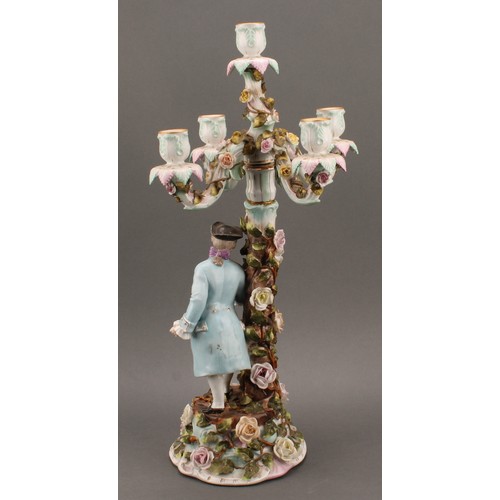 258 - A pair of Sitzendorf porcelain figural five-light candelabra, modelled as a courting couple, each pa... 