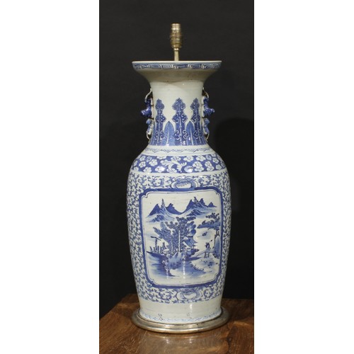 1306 - A large Chinese baluster vase, painted in tones of underglaze blue with a monumental landscape, on a... 