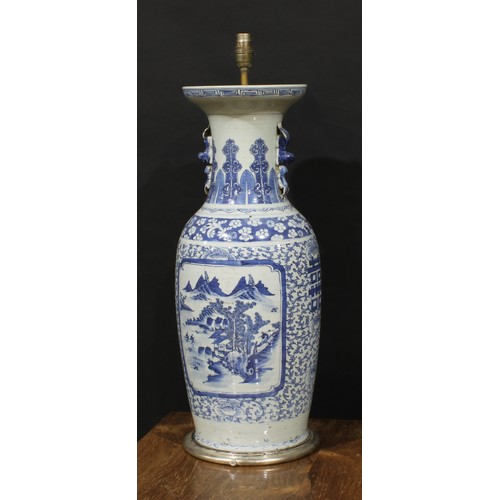 1306 - A large Chinese baluster vase, painted in tones of underglaze blue with a monumental landscape, on a... 