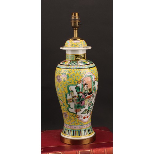 1295 - A Chinese baluster vase, painted in polychrome enamels with warriors on a yellow ground, mounted as ... 