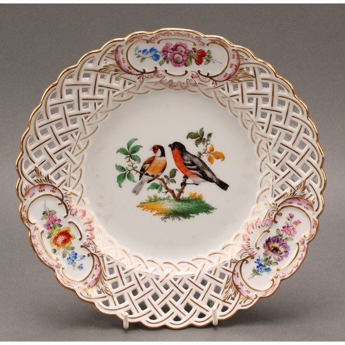 230 - A German reticulated porcelain fourteen-piece dessert service, comprising a pair of comports and twe... 