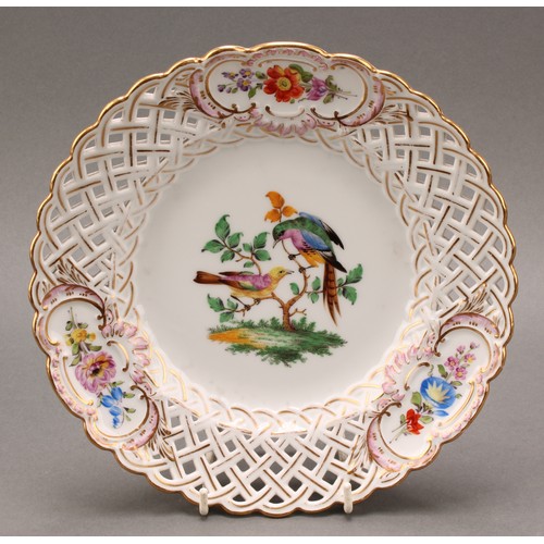 230 - A German reticulated porcelain fourteen-piece dessert service, comprising a pair of comports and twe... 