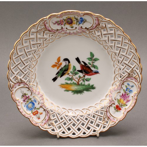 230 - A German reticulated porcelain fourteen-piece dessert service, comprising a pair of comports and twe... 