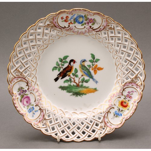 230 - A German reticulated porcelain fourteen-piece dessert service, comprising a pair of comports and twe... 