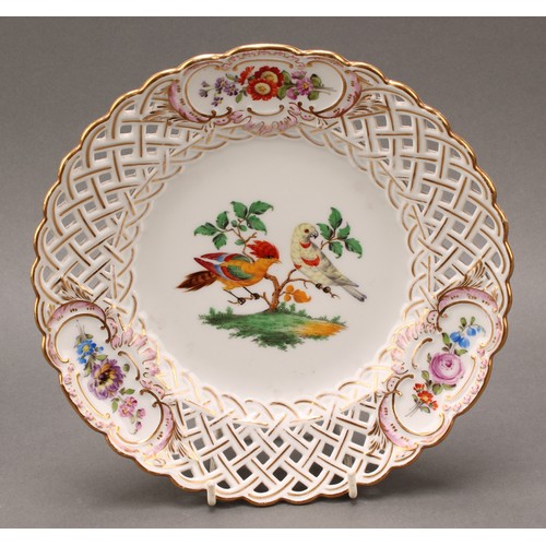 230 - A German reticulated porcelain fourteen-piece dessert service, comprising a pair of comports and twe... 