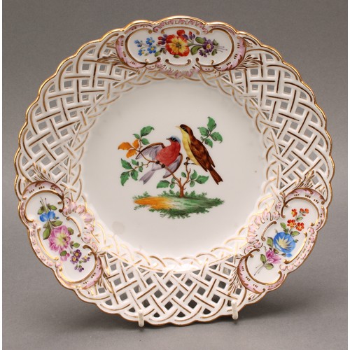 230 - A German reticulated porcelain fourteen-piece dessert service, comprising a pair of comports and twe... 