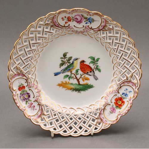 230 - A German reticulated porcelain fourteen-piece dessert service, comprising a pair of comports and twe... 