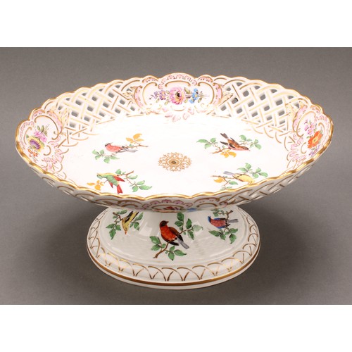 230 - A German reticulated porcelain fourteen-piece dessert service, comprising a pair of comports and twe... 