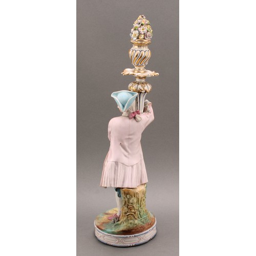 246 - A pair of Continental bisque porcelain figural candlesticks, as a courting couple in 18th century dr... 