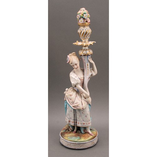 246 - A pair of Continental bisque porcelain figural candlesticks, as a courting couple in 18th century dr... 