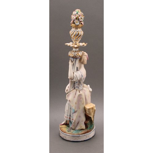 246 - A pair of Continental bisque porcelain figural candlesticks, as a courting couple in 18th century dr... 