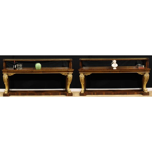 1945 - A pair of substantial Post-Regency rosewood and parcel-gilt pier tables, of country house proportion... 