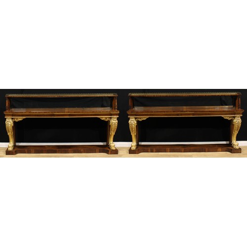 1945 - A pair of substantial Post-Regency rosewood and parcel-gilt pier tables, of country house proportion... 