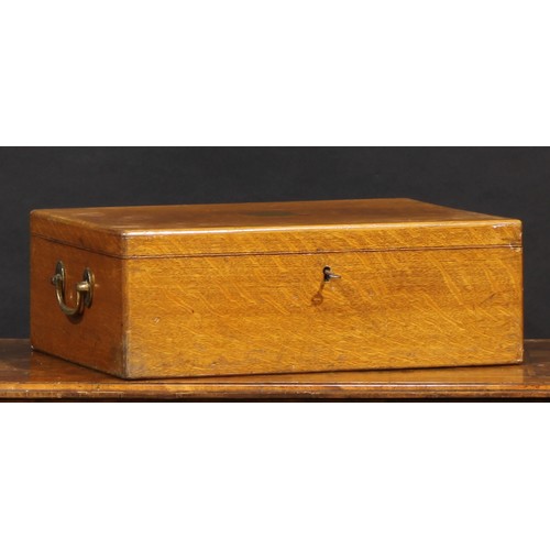 2344 - An early 20th century oak canteen, hinged cover inlaid with a vacant brass shield shaped cartouche a... 