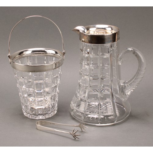 994 - An Art Deco period silver mounted refreshment suite, comprising lemonade jug and ice bucket, star-cu... 