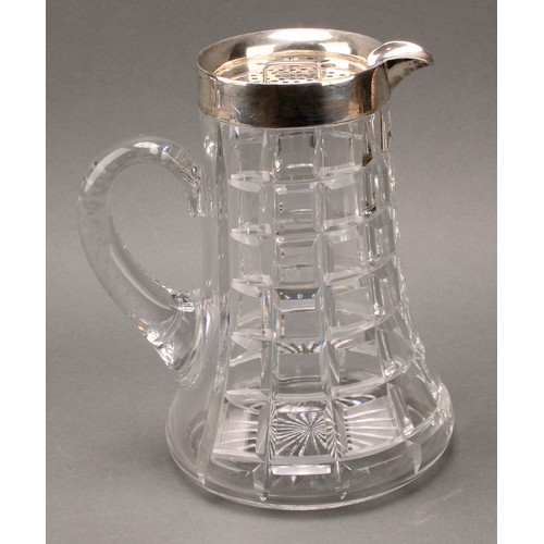 994 - An Art Deco period silver mounted refreshment suite, comprising lemonade jug and ice bucket, star-cu... 