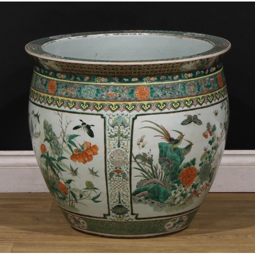 1307 - A large Chinese ovoid fish bowl, painted in the famille verte palette with birds, flowers and insect... 