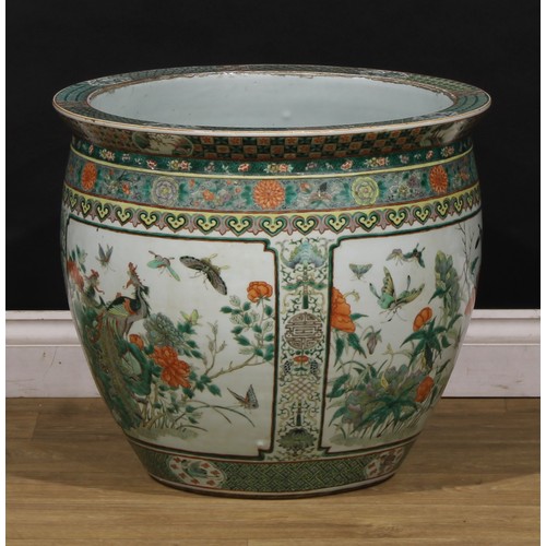 1307 - A large Chinese ovoid fish bowl, painted in the famille verte palette with birds, flowers and insect... 