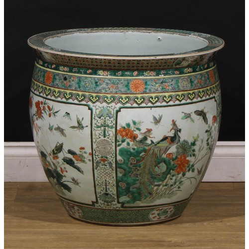 1307 - A large Chinese ovoid fish bowl, painted in the famille verte palette with birds, flowers and insect... 