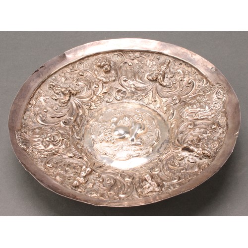 731 - A Continental silver circular dish, probably German, chased in the Renaissance taste with a border o... 