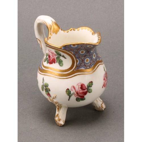 267 - A Sevres baluster cream jug, painted with roses, gilt borders, rustic branch feet, 8cm high, interla... 