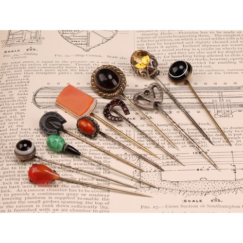 1402 - Stick Pins - a late 19th century base metal polished agate bull's eye pin, 7cm; others, polished pea... 