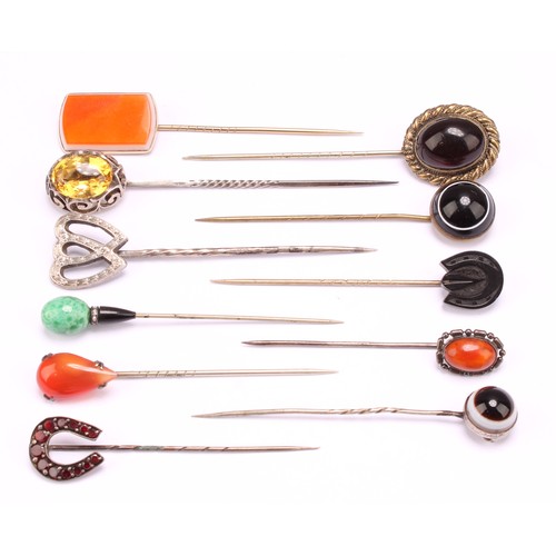 1402 - Stick Pins - a late 19th century base metal polished agate bull's eye pin, 7cm; others, polished pea... 