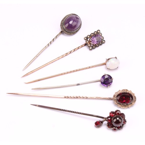 1401 - Stick Pins - a late 19th century 9ct rose gold pin, set with a single polished opal cabochon, 5.5cm,... 