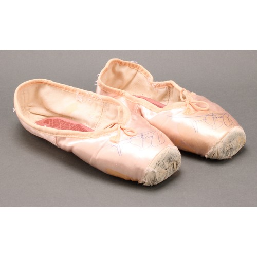 2473 - Autographs - a pair of Innovation Dance Workshop silk ballet shoes, signed by Darcy Bussell (b. 1969... 