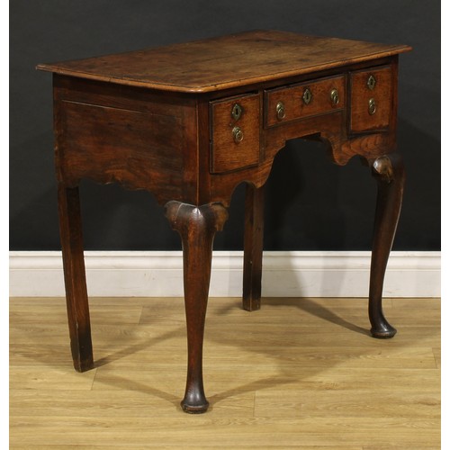 2360 - A George II oak lowboy, rounded rectangular moulded oversailing top above three frieze drawers, shap... 