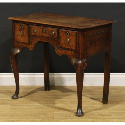 2360 - A George II oak lowboy, rounded rectangular moulded oversailing top above three frieze drawers, shap... 