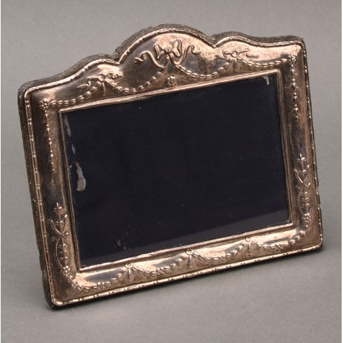 995 - An Art Nouveau silver easel photograph frame, 22cm high, Birmingham c. 1905; another; a pair of dwar... 