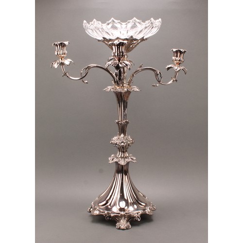 691 - A substantial Victorian Rococo Revival silver plated table centrepiece, central cut glass dish above... 